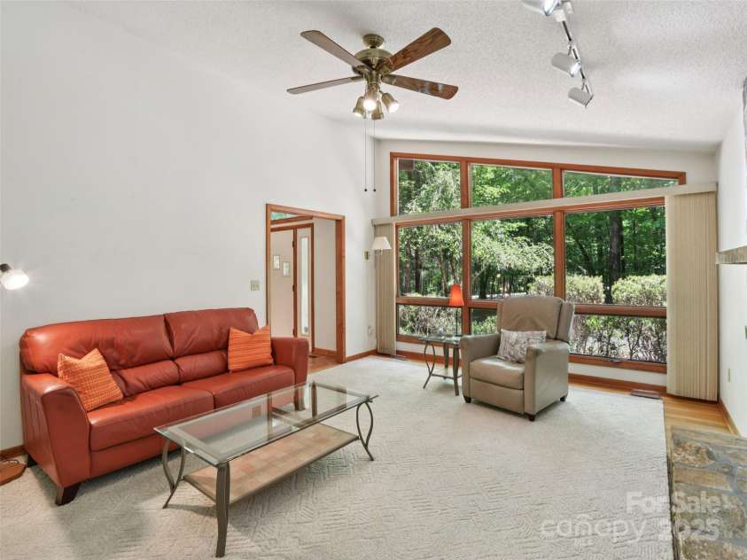 105 Sunningdale Drive, Flat Rock, NC 28731.  MLS# CAR4274018, YatesRealty ID 22781. Family Room with Wood Burning Fireplace off Foyer