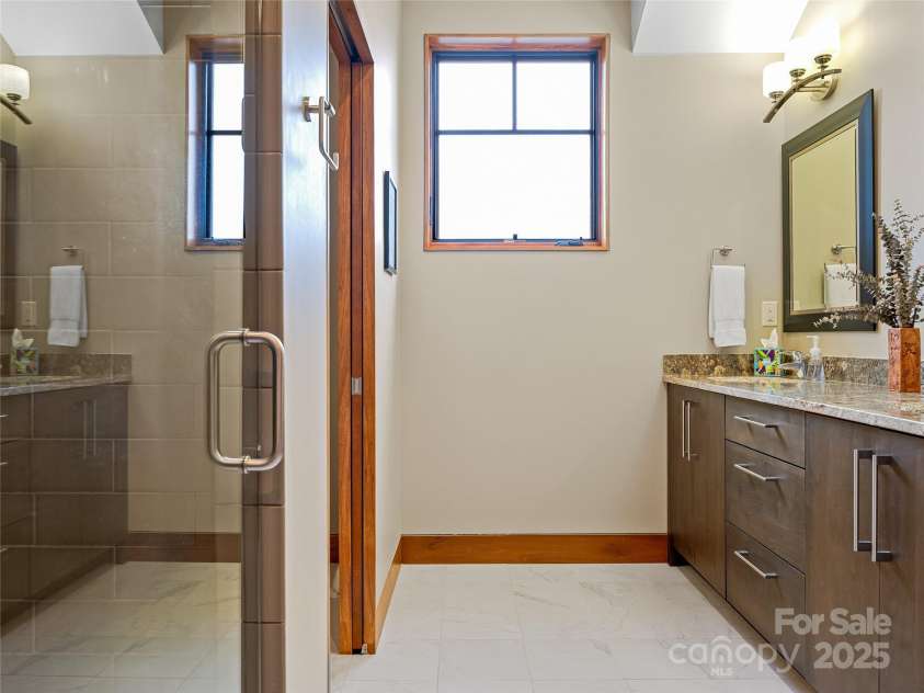 3 Turkey Roost Court, Fairview, NC 28730.  MLS# CAR4273755, YatesRealty ID 22782. Hall Bathroom - walkin shower, double vanity, toilet and linen closet