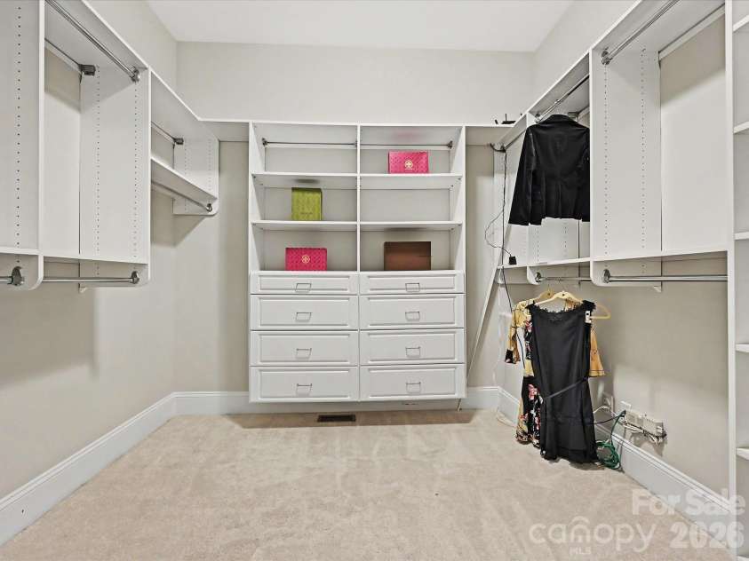 1023 Trinity Ridge Parkway, Fort Mill, SC 29715.  MLS# CAR4372318, YatesRealty ID 22784. Custom walk-in closet with exceptional storage and organization.