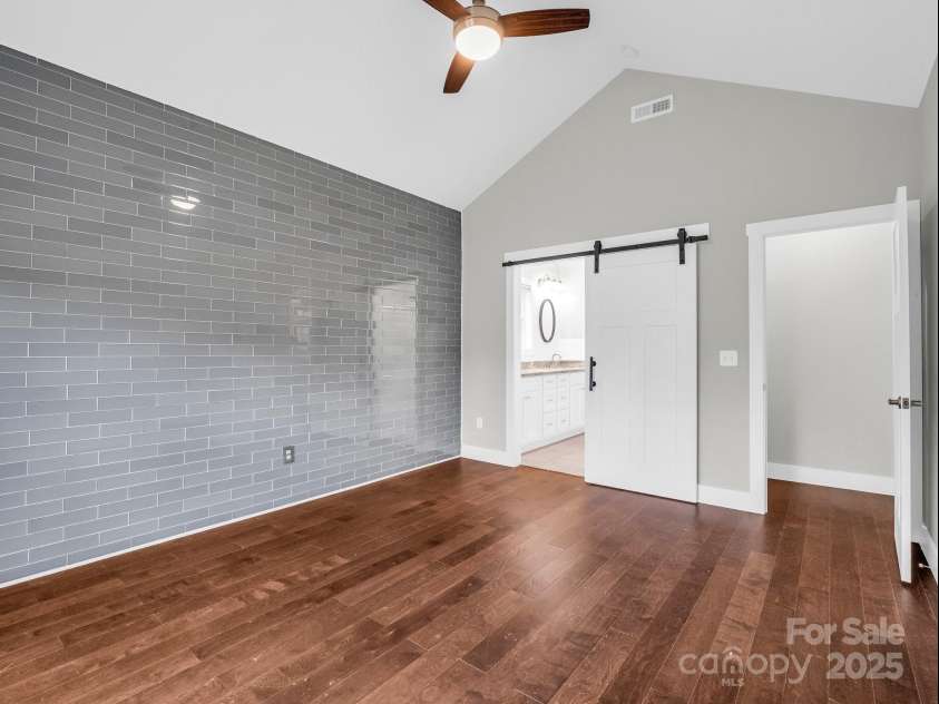 62 Leyland Circle, Hendersonville, NC 28792.  MLS# CAR4270363, YatesRealty ID 22784. Primary Ensuite with Tile Accent Wall
