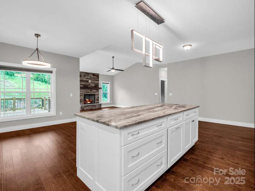 62 Leyland Circle, Hendersonville, NC 28792.  MLS# CAR4270363, YatesRealty ID 22784. Sellers added custom counter island from the standard kitchen plans in The Cottages at Cypress Run.