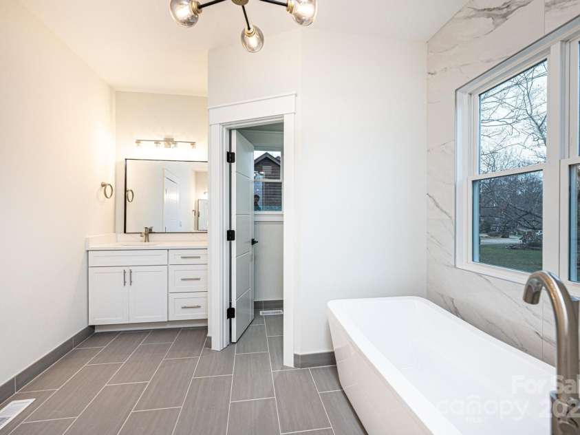 1328 33rd Avenue Drive, Hickory, NC 28601.  MLS# CAR4327859, YatesRealty ID 2279. Primary En-Suite Bath with Soaking Tub, Separate Walk in Shower, Private Water Closet and His and Her Vanities