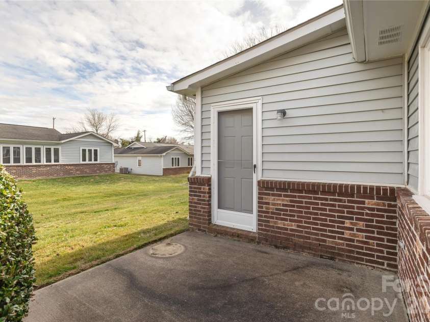 228 Dartcrest Drive, Hendersonville, NC 28792.  MLS# CAR4341599, YatesRealty ID 2279. Back patio