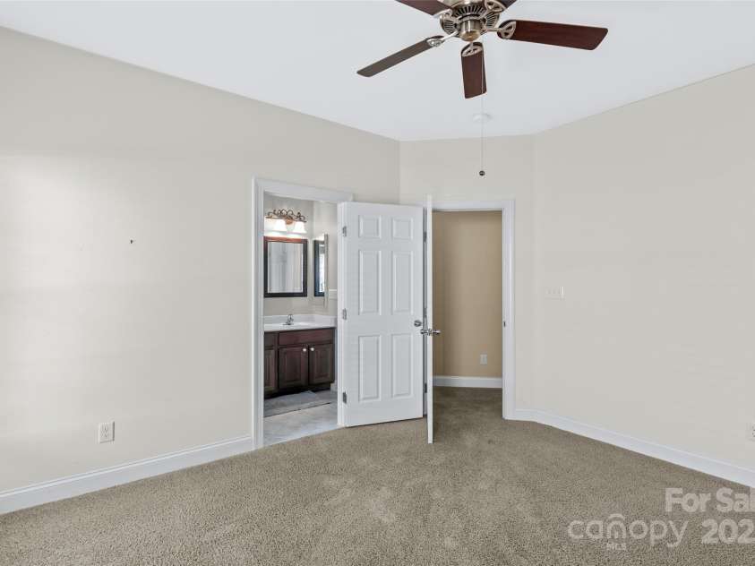 1119 Williamstown Road, Matthews, NC 28105.  MLS# CAR4271632, YatesRealty ID 22791. 2nd Bedroom with custom closet system and door to full bath off of hallway