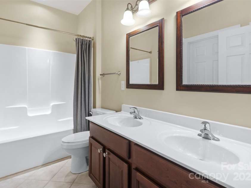 1119 Williamstown Road, Matthews, NC 28105.  MLS# CAR4271632, YatesRealty ID 22791. Full Bath between bedrooms with double sinks