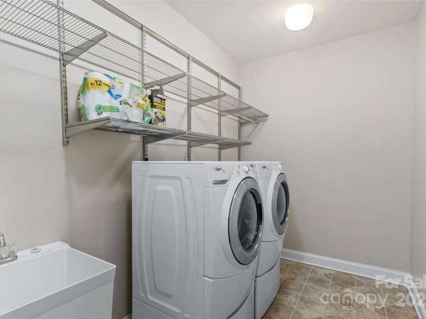 1119 Williamstown Road, Matthews, NC 28105.  MLS# CAR4271632, YatesRealty ID 22791. Laundry Room with Washer/Dryer and sink