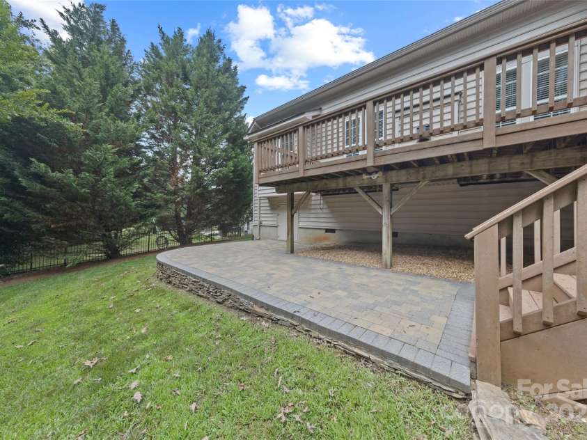 1119 Williamstown Road, Matthews, NC 28105.  MLS# CAR4271632, YatesRealty ID 22791. Paver patio with large crawl space with storage