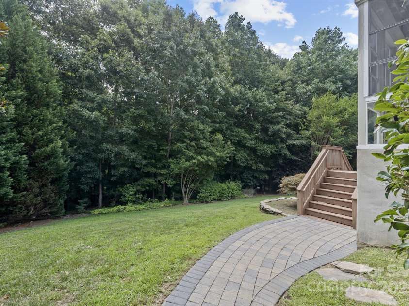 1119 Williamstown Road, Matthews, NC 28105.  MLS# CAR4271632, YatesRealty ID 22791. Side path to back deck and patio