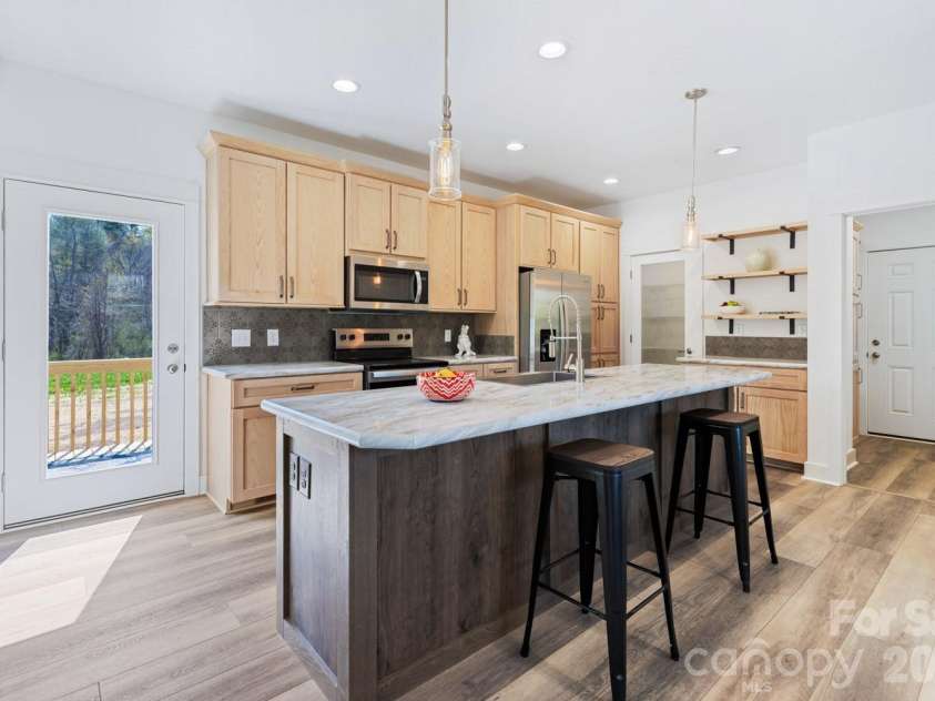 139 Mullinax Drive, Hendersonville, NC 28792.  MLS# CAR4369698, YatesRealty ID 22792. The open floor plan makes entertaining a breeze!
