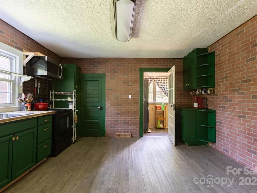 3419 Boat Club Road, Belmont, NC 28012.  MLS# CAR4273967, YatesRealty ID 22793. Huge kitchen (behind the green door is a walk in pantry)