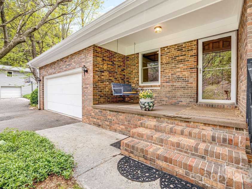 6334 Jacks Creek Road, Burnsville, NC 28714.  MLS# CAR4259403, YatesRealty ID 22798. Front entrance to the main house.