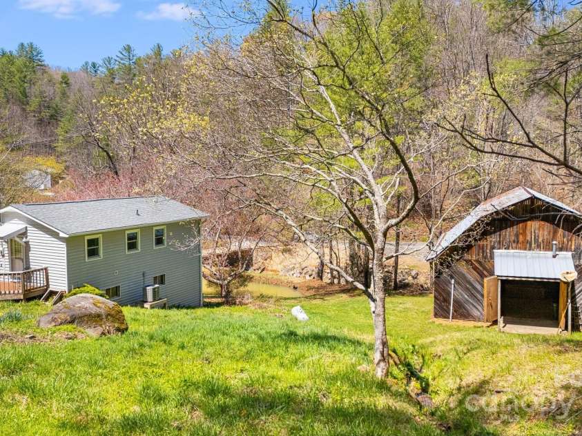 6334 Jacks Creek Road, Burnsville, NC 28714.  MLS# CAR4259403, YatesRealty ID 22798. Guest house & barn