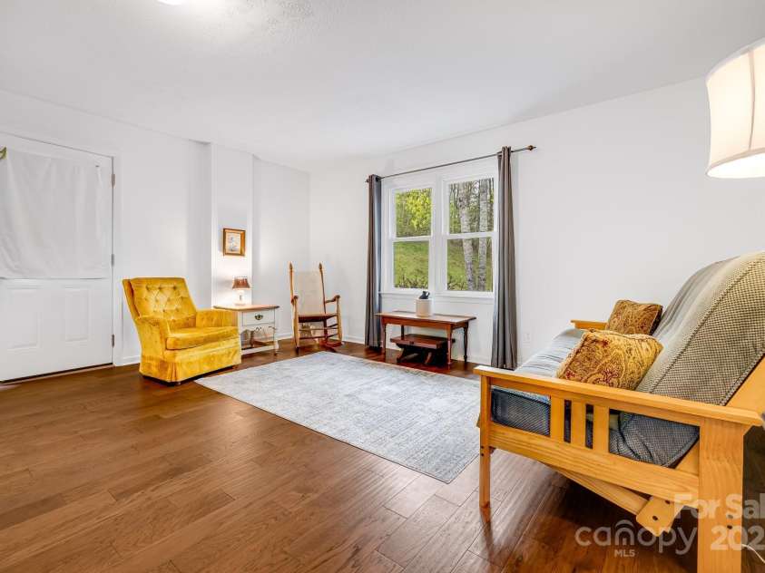 6334 Jacks Creek Road, Burnsville, NC 28714.  MLS# CAR4259403, YatesRealty ID 22798. Guest house living room.