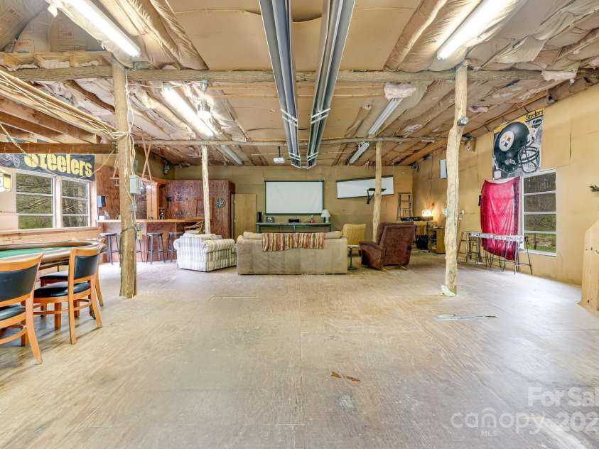 6334 Jacks Creek Road, Burnsville, NC 28714.  MLS# CAR4259403, YatesRealty ID 22798. Large screens for viewing movies & sporting events.
