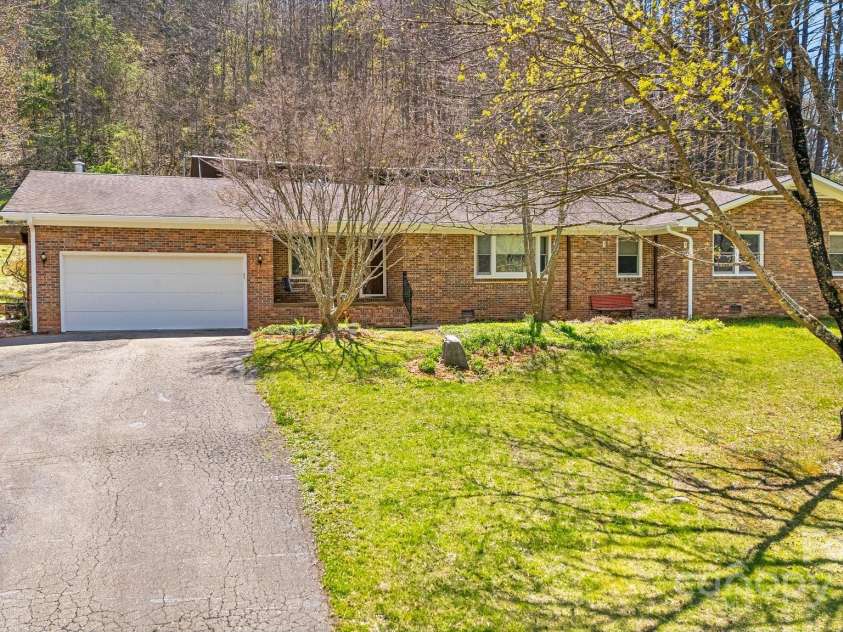 6334 Jacks Creek Road, Burnsville, NC 28714.  MLS# CAR4259403, YatesRealty ID 22798. One level living in the main house w/oversized garage, 3 bedrooms & 2 baths.