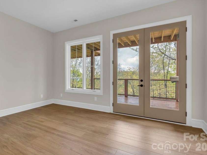 380 Greystone Drive, Boone, NC 28607.  MLS# CAR4367941, YatesRealty ID 22800. Lower-level bedroom suite 1