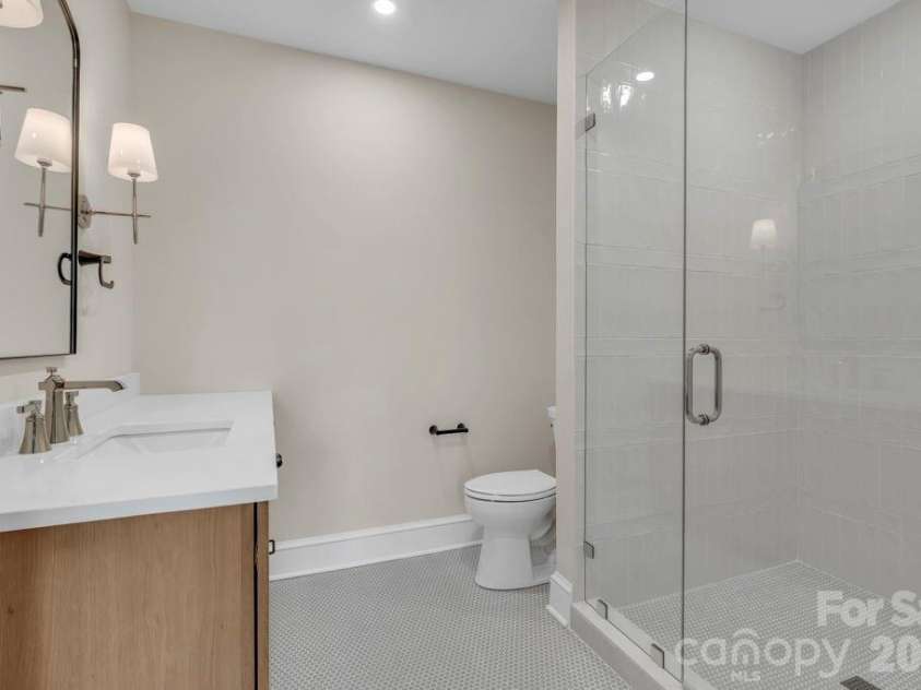 380 Greystone Drive, Boone, NC 28607.  MLS# CAR4367941, YatesRealty ID 22800. Lower-level bedroom suite 1