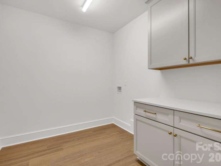 380 Greystone Drive, Boone, NC 28607.  MLS# CAR4367941, YatesRealty ID 22800. Lower-level laundry room