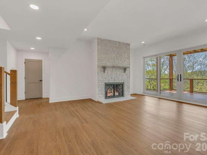 380 Greystone Drive, Boone, NC 28607.  MLS# CAR4367941, YatesRealty ID 22800. Lower-level living room