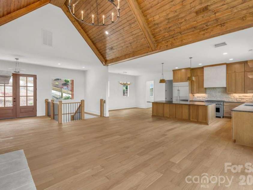 380 Greystone Drive, Boone, NC 28607.  MLS# CAR4367941, YatesRealty ID 22800. Open Great Room, Kitchen, & Dining area
