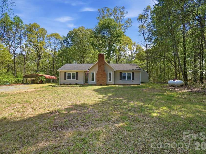 4415 Potter Road, Monroe, NC 28112.  MLS# CAR4364056, YatesRealty ID 22803. Large front yard