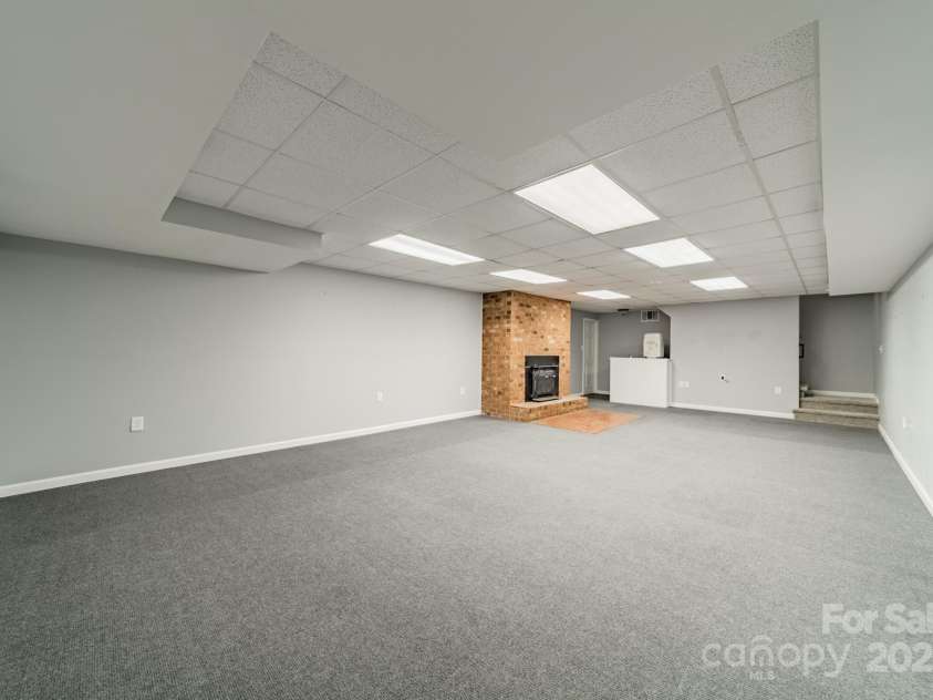 532 Courtney Lane, Matthews, NC 28105.  MLS# CAR4252271, YatesRealty ID 22805. Basement Bonus Room with fireplace