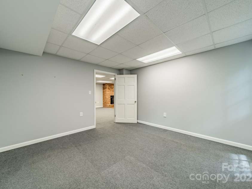 532 Courtney Lane, Matthews, NC 28105.  MLS# CAR4252271, YatesRealty ID 22805. Basement office looking out into the Bonus Room