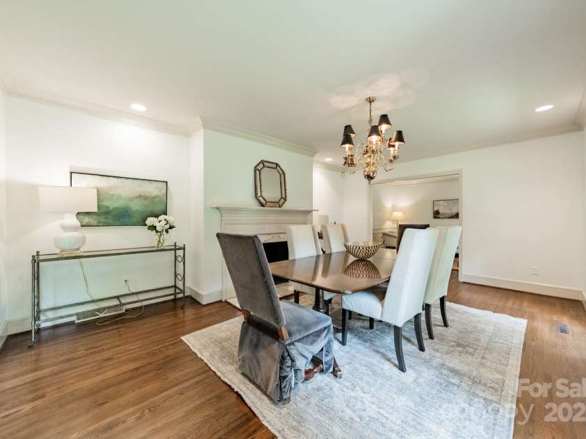 532 Courtney Lane, Matthews, NC 28105.  MLS# CAR4252271, YatesRealty ID 22805. Beautiful hardwood floors and a fireplace make the Dining Room a wonderful place to entertain