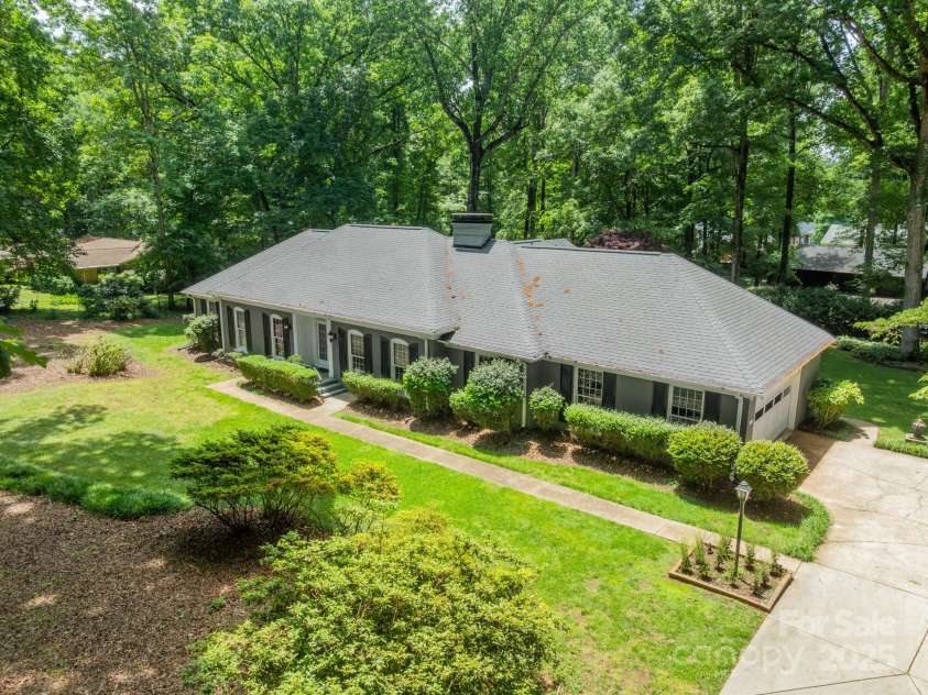 532 Courtney Lane, Matthews, NC 28105.  MLS# CAR4252271, YatesRealty ID 22805. Peaceful, private retreat on almost 2 acres in Matthews!  The building in the back right is a detached 3 car garage perfect for a workshop, room for hobbies, car-collecting, etc...
