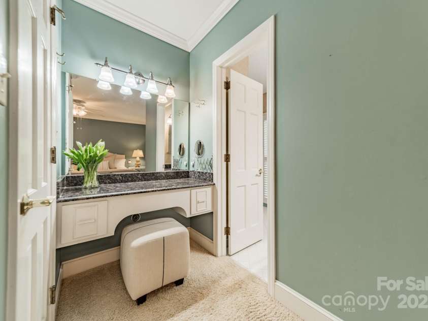 532 Courtney Lane, Matthews, NC 28105.  MLS# CAR4252271, YatesRealty ID 22805. Vanity area in Primary.  Door on the left is the closet and the door on the right is the bathroom.