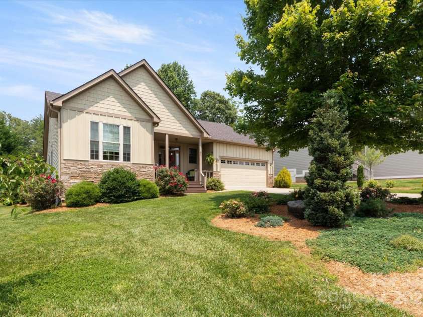 91 Triple Fairways Drive, Hendersonville, NC 28739.  MLS# CAR4265279, YatesRealty ID 22810. Cozy Covered Front Porch to Enjoy