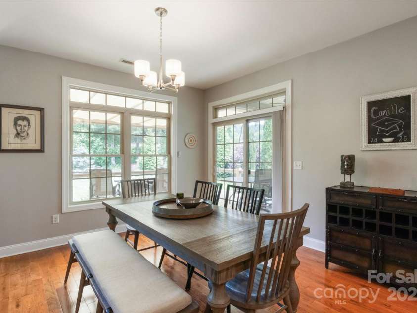 91 Triple Fairways Drive, Hendersonville, NC 28739.  MLS# CAR4265279, YatesRealty ID 22810. Dining Area has Entry to the Covered Deck