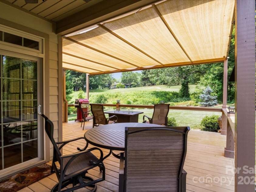 91 Triple Fairways Drive, Hendersonville, NC 28739.  MLS# CAR4265279, YatesRealty ID 22810. Large Covered Deck Area with Views of the Fairway.
