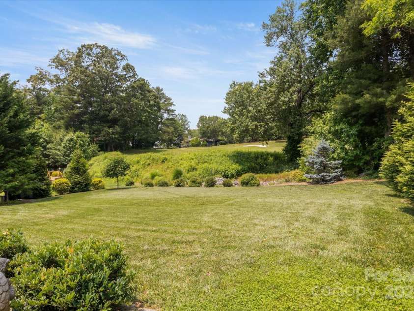 91 Triple Fairways Drive, Hendersonville, NC 28739.  MLS# CAR4265279, YatesRealty ID 22810. View of Back Yard & Fairway