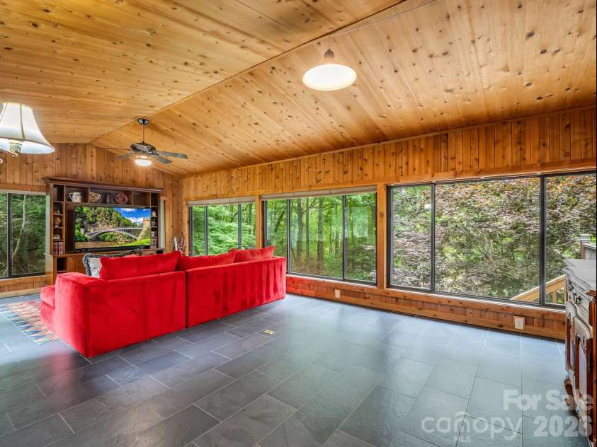 425 Winesap Boulevard, Lake Lure, NC 28746.  MLS# CAR4372379, YatesRealty ID 22818. Sunroom 4 seasons room main floor