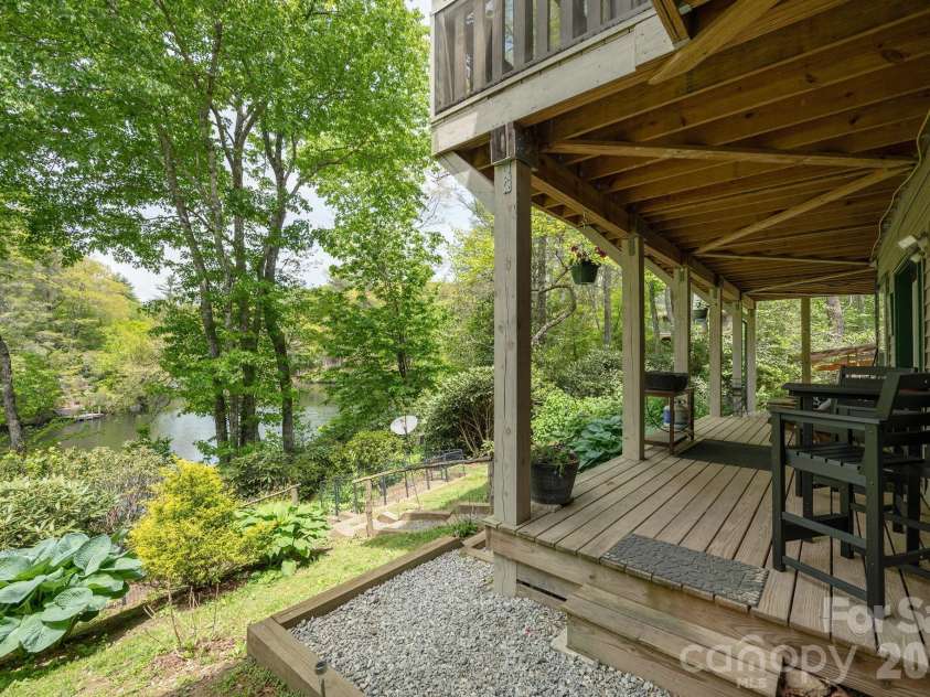 149 Hiwassee Road, Lake Toxaway, NC 28747.  MLS# CAR4377735, YatesRealty ID 22821. Covered deck down stairs