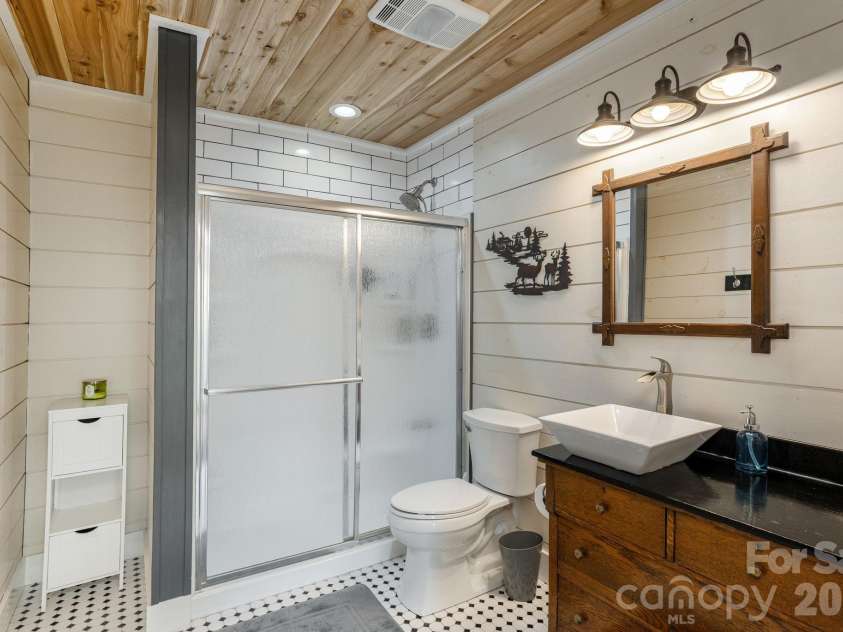 149 Hiwassee Road, Lake Toxaway, NC 28747.  MLS# CAR4377735, YatesRealty ID 22821. Downstairs full bathroom