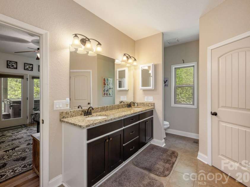 149 Hiwassee Road, Lake Toxaway, NC 28747.  MLS# CAR4377735, YatesRealty ID 22821. Primary bathroom with double vanity