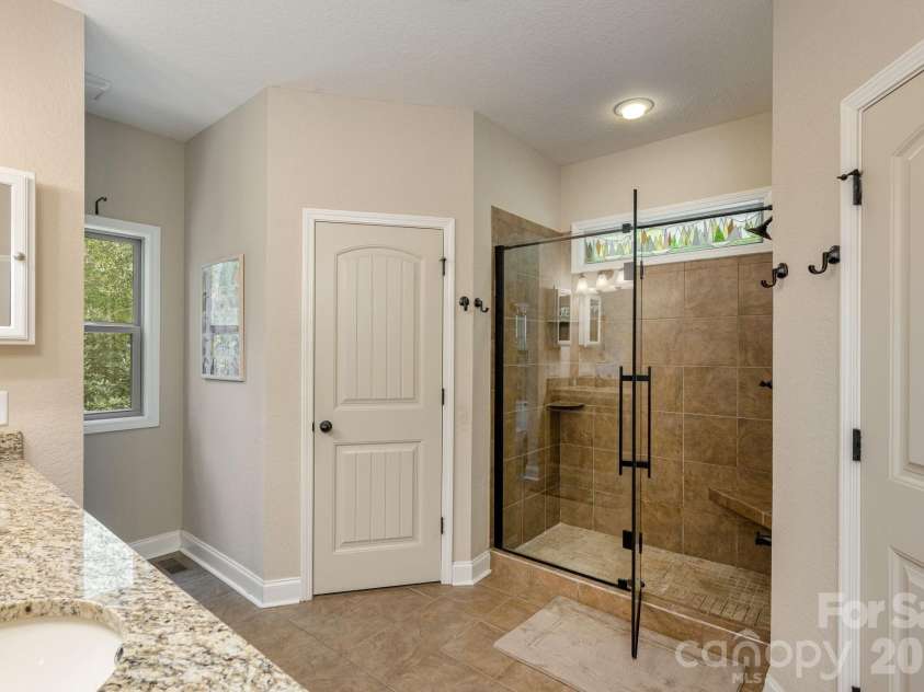 149 Hiwassee Road, Lake Toxaway, NC 28747.  MLS# CAR4377735, YatesRealty ID 22821. Walk-in oversized shower