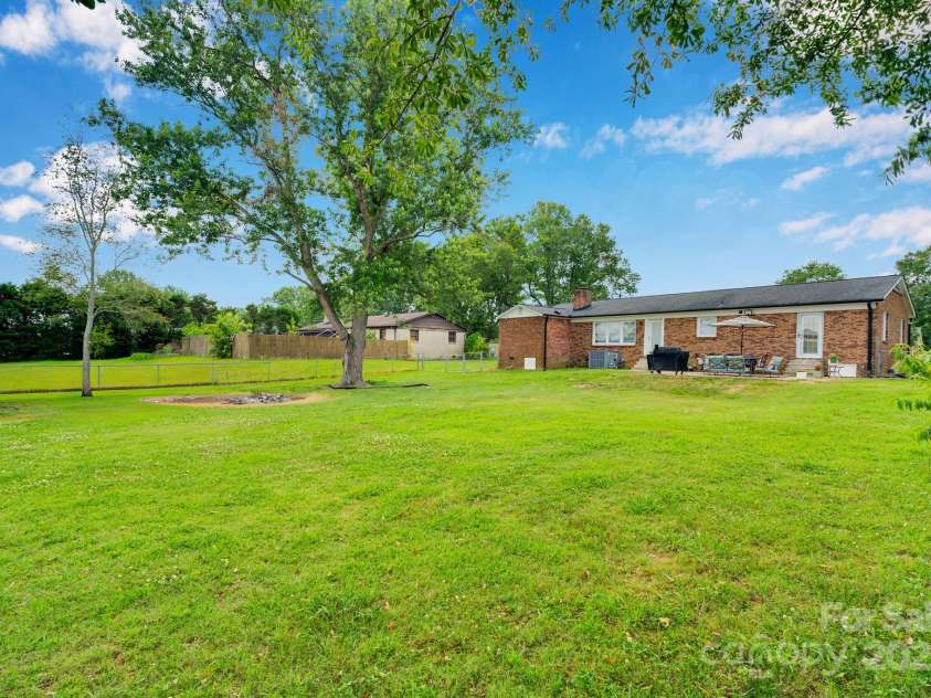 905 Blalock Drive, Kings Mountain, NC 28086.  MLS# CAR4228264, YatesRealty ID 22827. Mature trees - safe distance from home