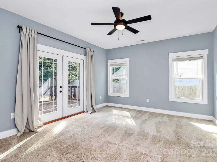 323 Keswick Avenue, Charlotte, NC 28206.  MLS# CAR4271562, YatesRealty ID 22833. Bedroom #1 - Primary Suite with private entrance to the back deck