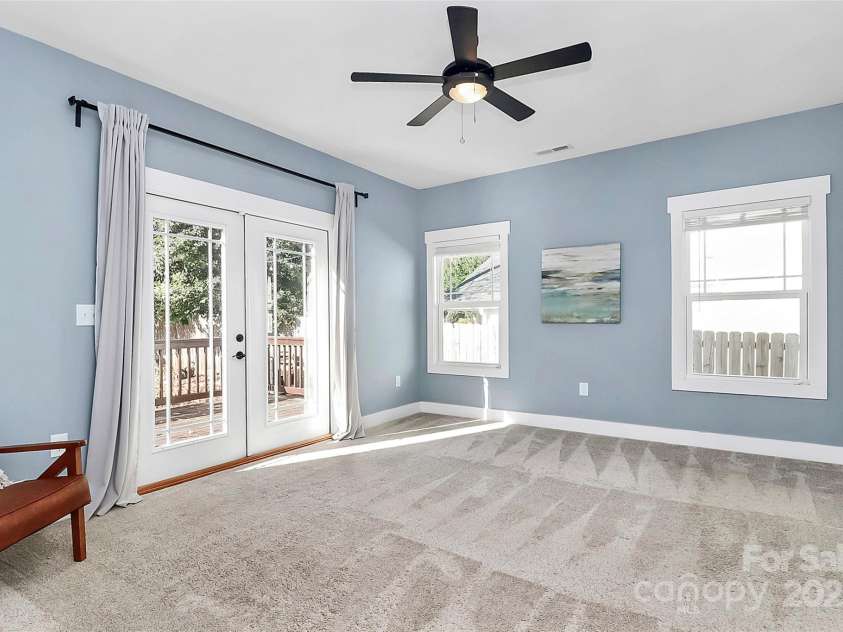 323 Keswick Avenue, Charlotte, NC 28206.  MLS# CAR4271562, YatesRealty ID 22833. Bedroom #1 - Primary Suite with private entrance to the back deck