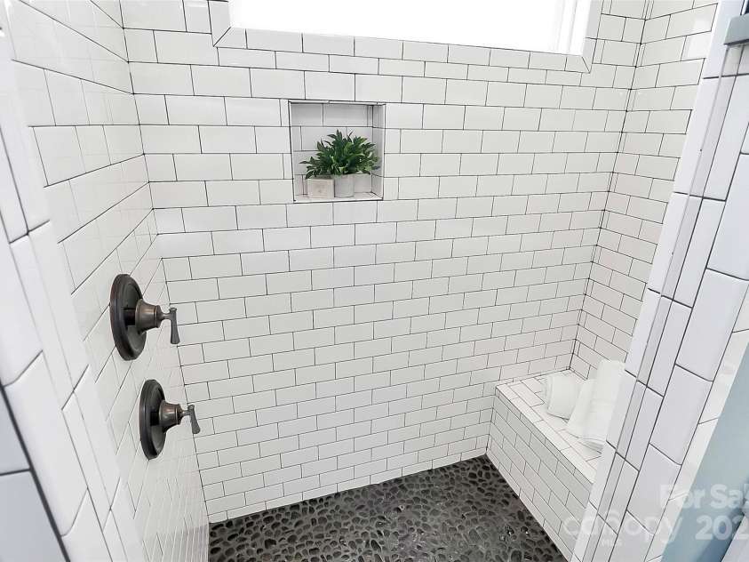 323 Keswick Avenue, Charlotte, NC 28206.  MLS# CAR4271562, YatesRealty ID 22833. Custom Over-Sized Shower with built in bench