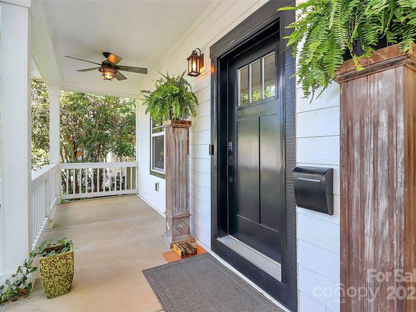 323 Keswick Avenue, Charlotte, NC 28206.  MLS# CAR4271562, YatesRealty ID 22833. Large covered front porch complete with fans, shades, and all the Southern Charm