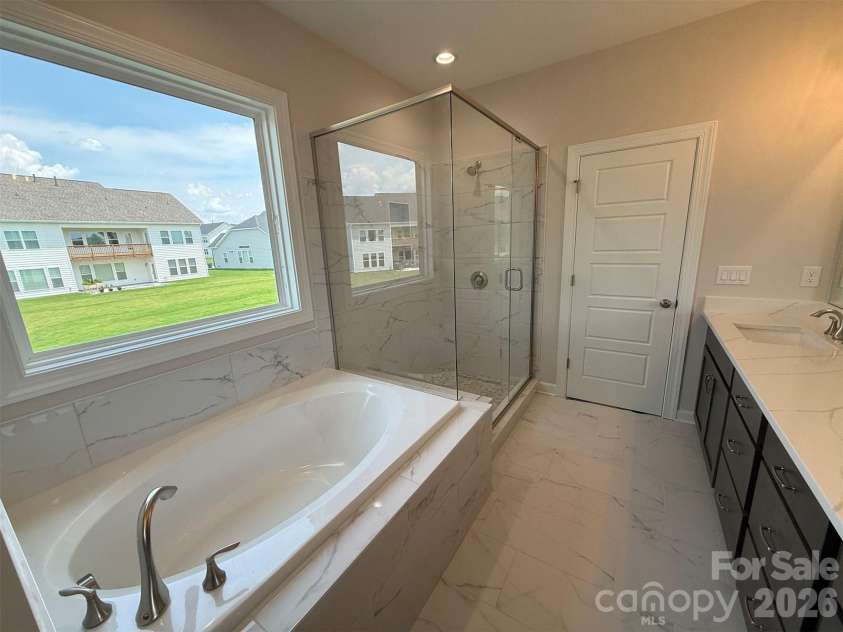 4237 Dahlia Drive, Harrisburg, NC 28075.  MLS# CAR4380418, YatesRealty ID 22837. Premier Bath