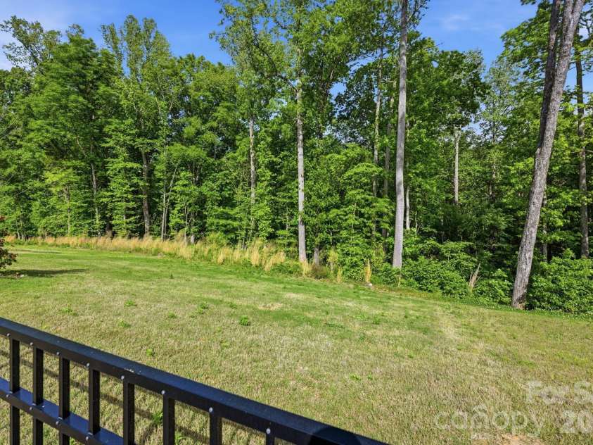 150 Scotsway Court, Troutman, NC 28166.  MLS# CAR4371353, YatesRealty ID 22844. Lower backyard adjoining HOA property