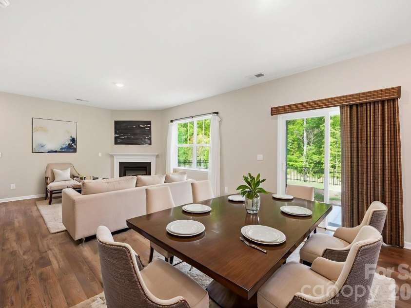 150 Scotsway Court, Troutman, NC 28166.  MLS# CAR4371353, YatesRealty ID 22844. Virtually staged dining/living area