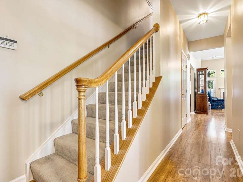 151 Talbert Town Loop, Mooresville, NC 28117.  MLS# CAR4367456, YatesRealty ID 22845. Open banister staircase