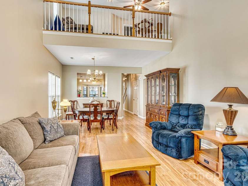 151 Talbert Town Loop, Mooresville, NC 28117.  MLS# CAR4367456, YatesRealty ID 22845. Open two-story grand room.