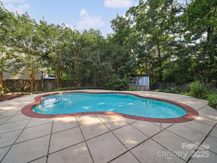 16411 Greybriar Forest Lane, Charlotte, NC 28278.  MLS# CAR4273245, YatesRealty ID 22845. Imagine yourself poolside!